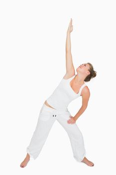 Woman doing extended traingle yoga pose