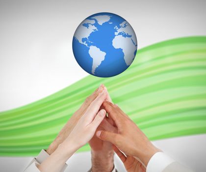 People reaching hands up to a globe against white background with green wave