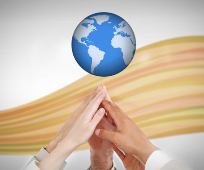 People reaching hands up to a globe against white background with orange wave