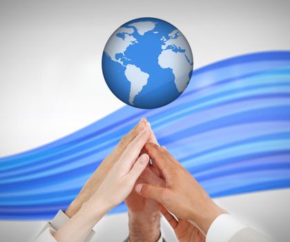 People reaching hands up to a globe against white background with blue wave