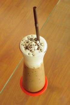 Cold fresh ice coffee with chocolate closeup.