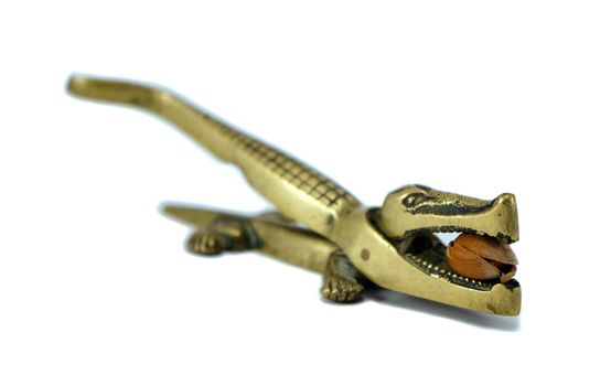 Steel crocodile tool for nut crush hull shell isolated on white.
