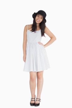 Smiling woman in summer dress hat and mary jane shoes