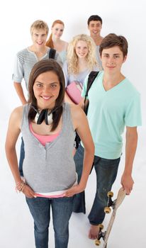 Happy teenagers smiling at the camera agaisnt white background