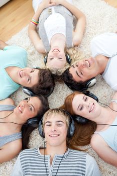 High angle of young Teenagers listening to music 