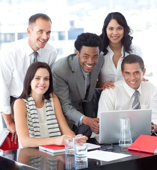 Happy multi-ethnic business team working together in office