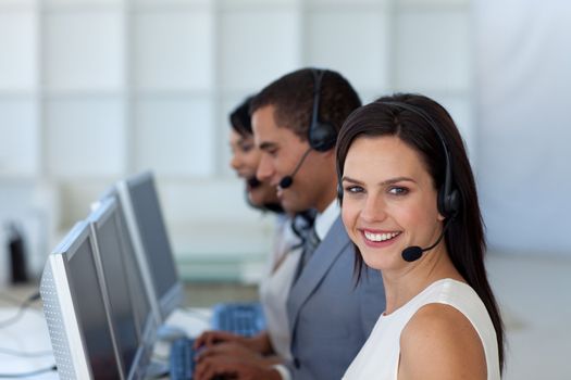 Smiling beautiful businesswoman working in a call canter 