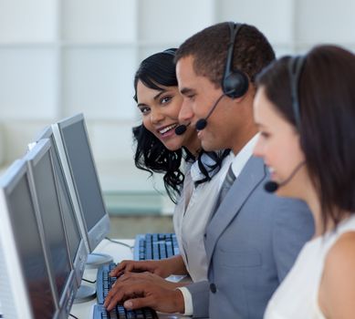 Smiling beautiful businesswoman working in a call canter 