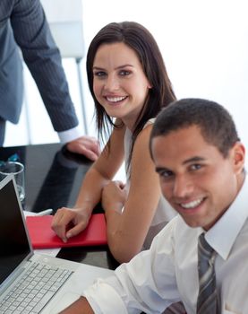 Beautiful businesswoman in a meeting with colleagues