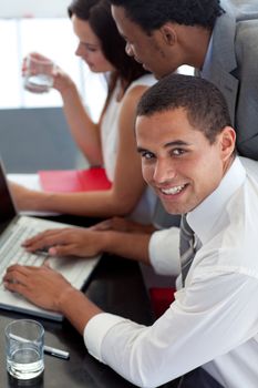 Businessman working with his colleagues in office