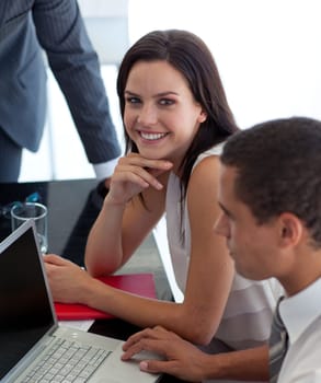 Beautiful businesswoman in office with colleagues