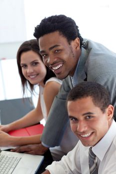 Business team working together with a laptop in office