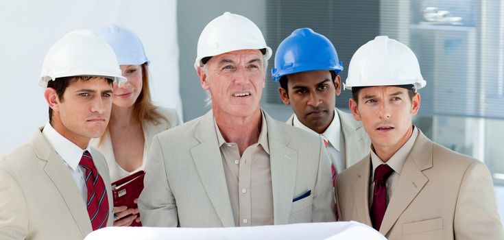 Portrait of a group of architect in a building site