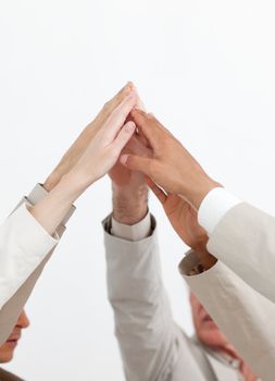 Business people showing teamwork spirit with hands up together
