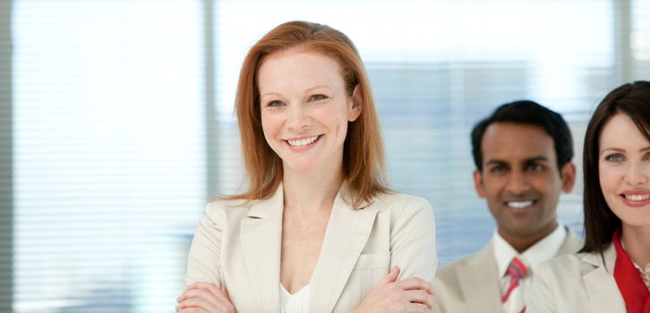 Smiling businesswoman with her colleagues in a business building