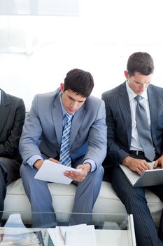 Concentrated Business people sitting and waiting for a job interview in an office