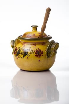 Handcrafted jar of honey with copy space on white background