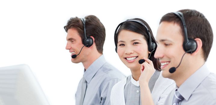 Assertive customer service agents working in a call center against a white background