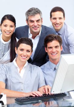 Successful business people working at a computer in a company