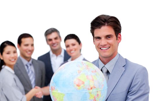 Successful manager and his team holding a terrestrial globe against a white background