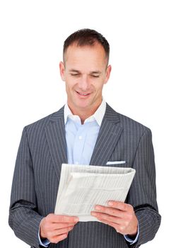 Positive businessman reading a newspaper against a white background