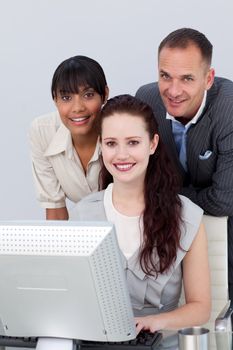 Multi-ethnic Business partners working together at a computer. Business concept.