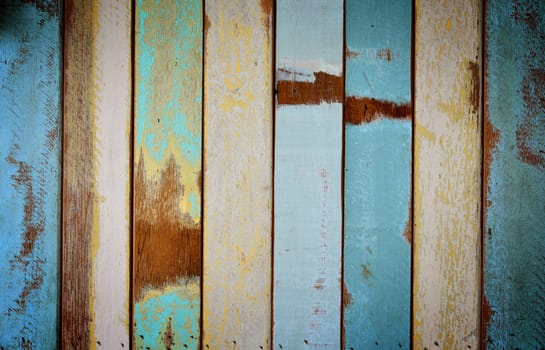 The old painted wooden wall with  variety color.