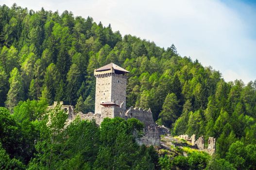 Ossana castle in the woods, trentino, Italy