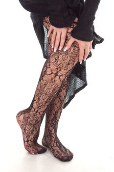 Beautiful woman legs in black stockings studio shoot