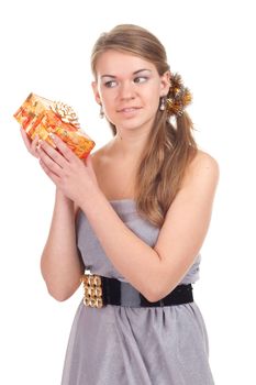 girl celebrates Christmas with a gift in the hands of studio photography