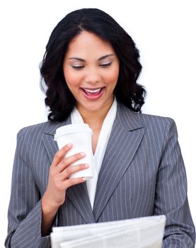 Young businesswoman drinking a coffee while reading a newspaper against a white background