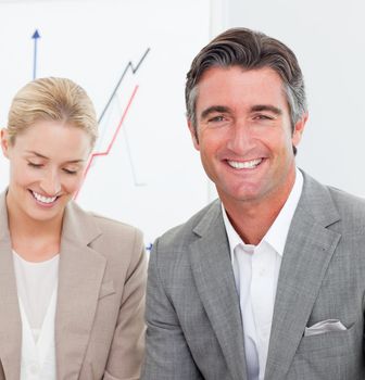 Close-up of business people at a meeting in a company