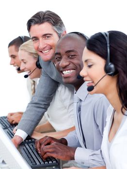 Confident manager checking his team's work in a call center