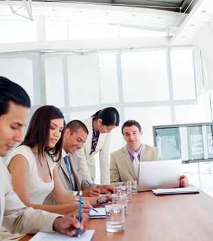 Positive business people having a meeting in a company