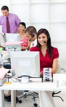 Multi-ethnic business people with headset on working in the office