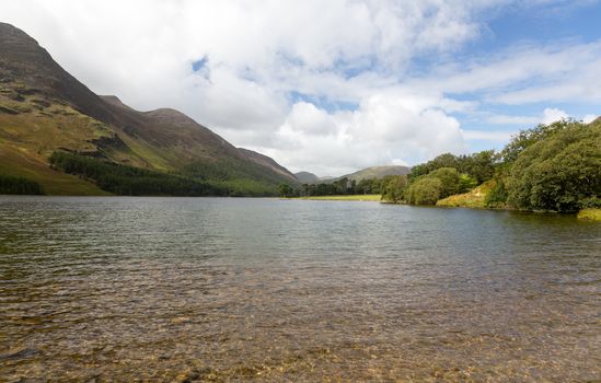 Buttermere lake in Lake District in England looking down length of the water