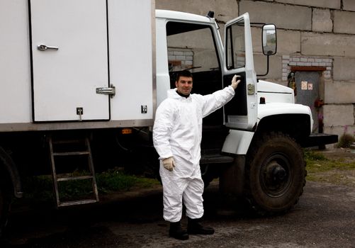 Nuclear plant worker in a white protective suit