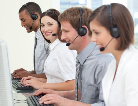 Business people with headset on working at computers
