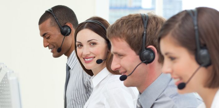 Young business people with headset on working in a call center