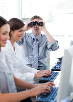 Animated businessman looking through binoculars in the office in a company