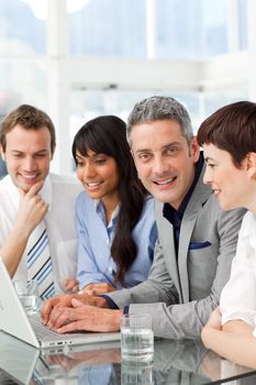 Multi-ethnic business partners sitting together in the office