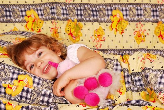 Beautiful happy little girl bedtime