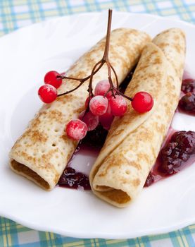 The pancakes with iced berry and fruit jam