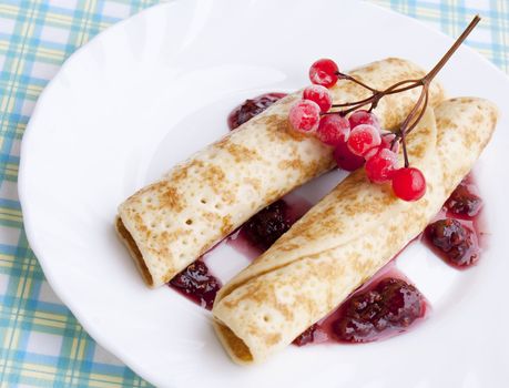 The pancakes with iced berry and fruit jam