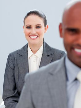 Young business people smiling at the camera