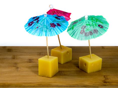 dutch cheese snacks with umbrella in blue red and green