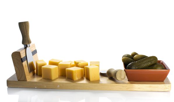 dutch cheese and pickle on wooden plate