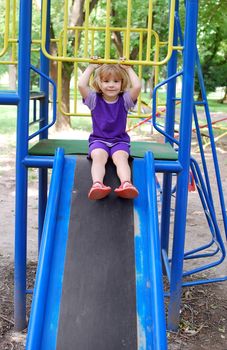 Beauty little girl in park playground