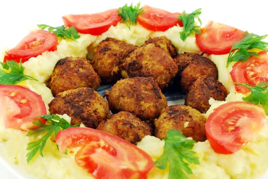 Meatballs with potato and tomatoes