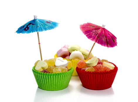 bleu and red umbrella in sweet candy cupcakes